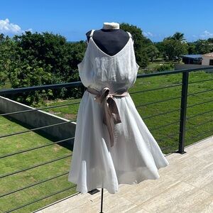 White chiffon dress lines. Adjustable spaghetti straps. Belt not included. Large